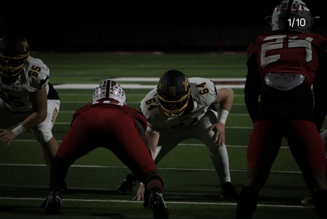 American football players lined up before the snap